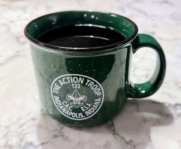 Green ceramic coffee mug with Troop 133 logo